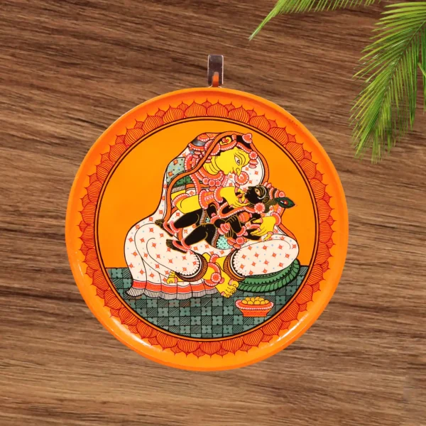 Lord Krishna sat on his mother Yashoda's lap